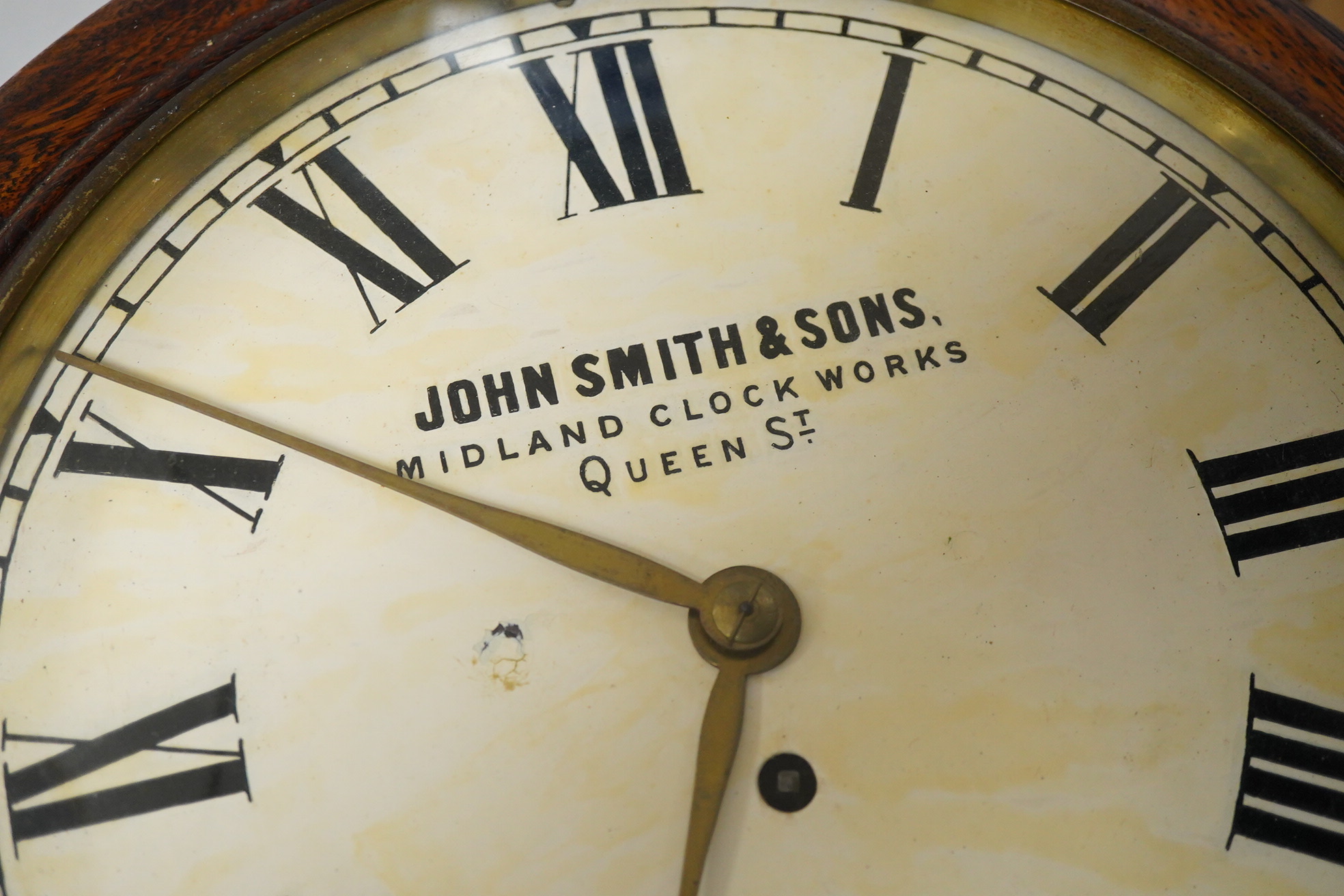 A John Smith & Sons of Derby oak wall clock, 39cm